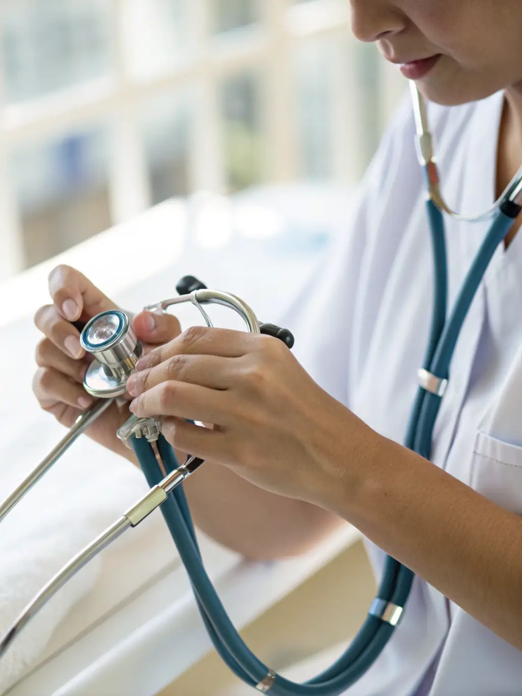 A close-up shot of a nurse administering medication using a smart infusion pump, highlighting the importance of accurate dosage and patient safety.